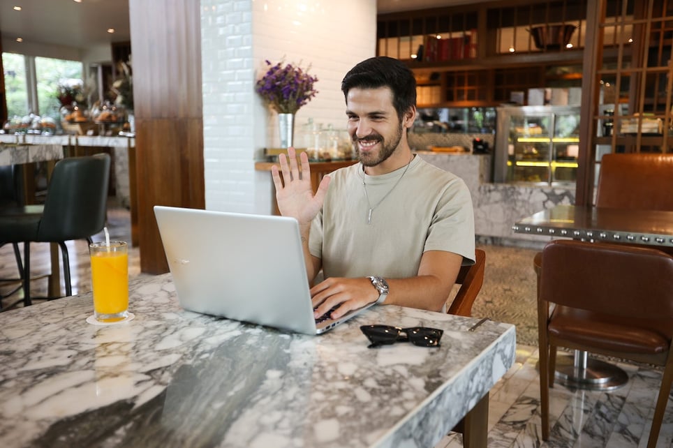 A-Man-using-Laptop-for-a-videocall-greatest-accomplishment