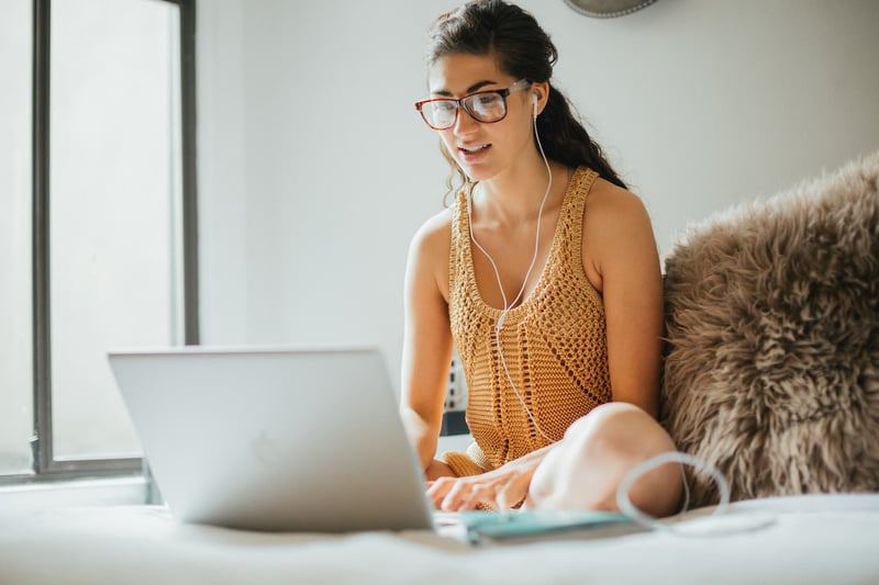 Business-Woman-Working-On-Bed-work-from-home-setup