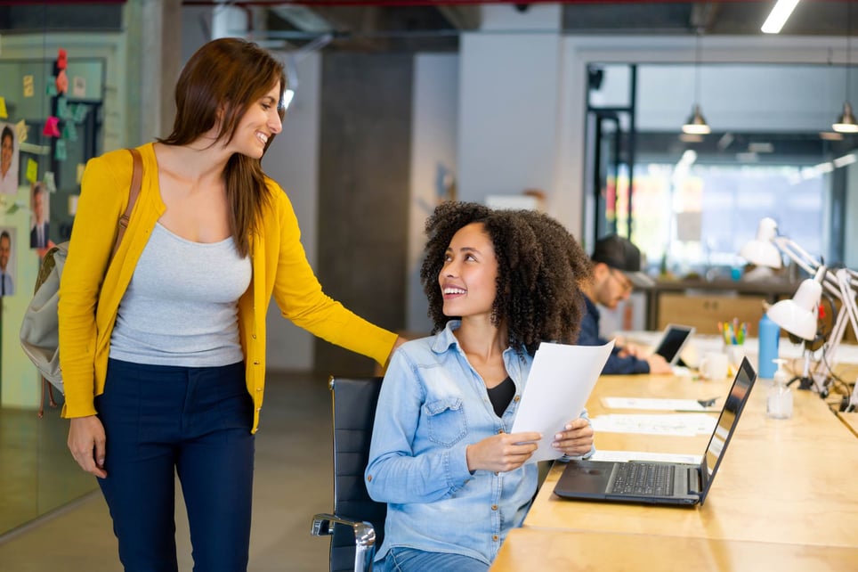 Business-woman-leaving-to-the-office-and-saying-goodbye-to-a-coworker-career-break
