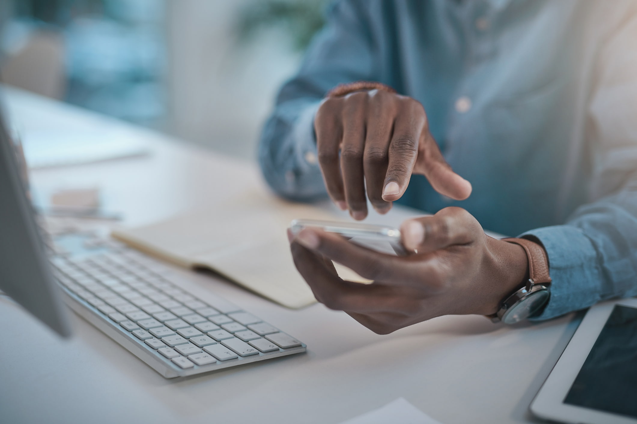 Businessman-using-a-smartphone-choosing-between-two-jobs