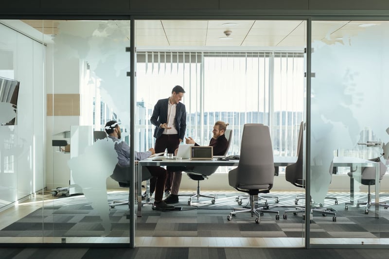 Businessmen-Having-A-Meeting-what-is-the-open-door-policy-workplace