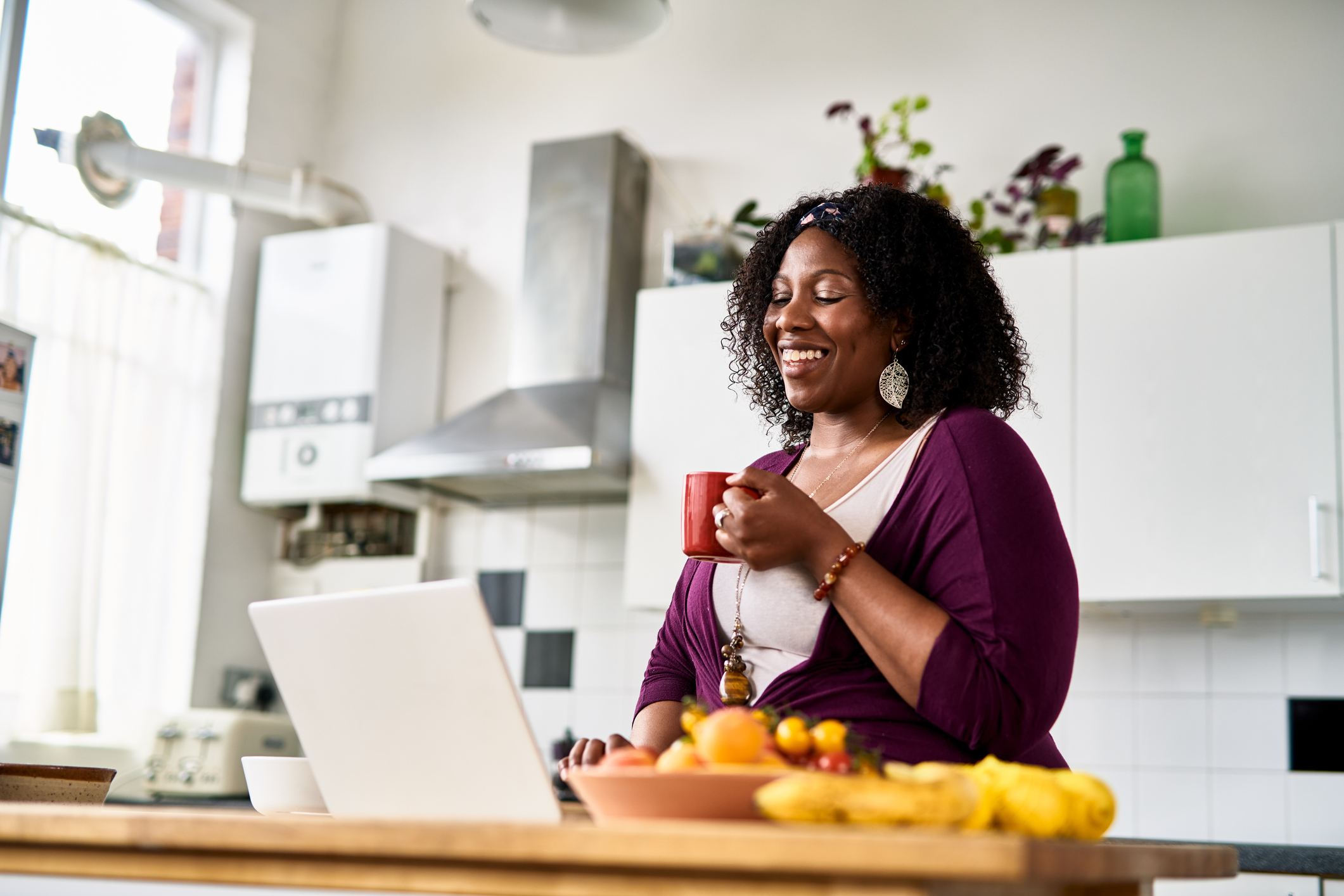Cheerful-mid-adult-woman-using-laptop-mindfulness-activities