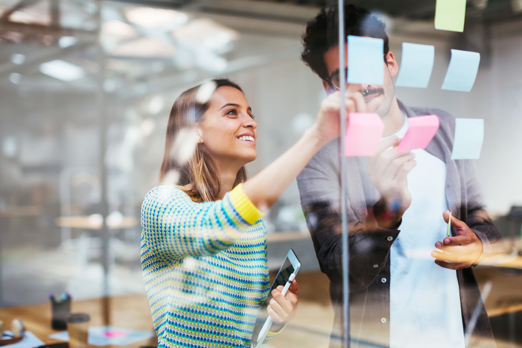 Colleagues-working-together-in-a-meeting-room-positive-thinking-benefits