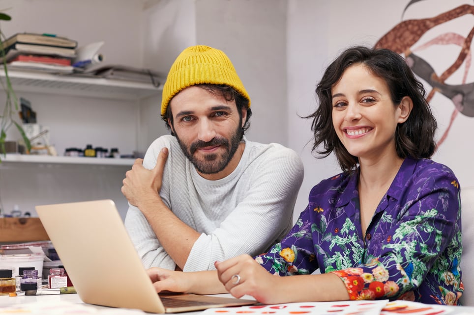 Confident-Artists-Sitting-At-Table-In-Studio-following-your-dreams