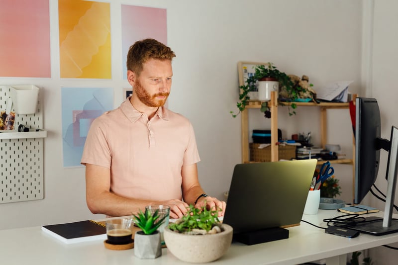 Ginger-Man-Working-At-Home-With-Computer-work-from-home-setup