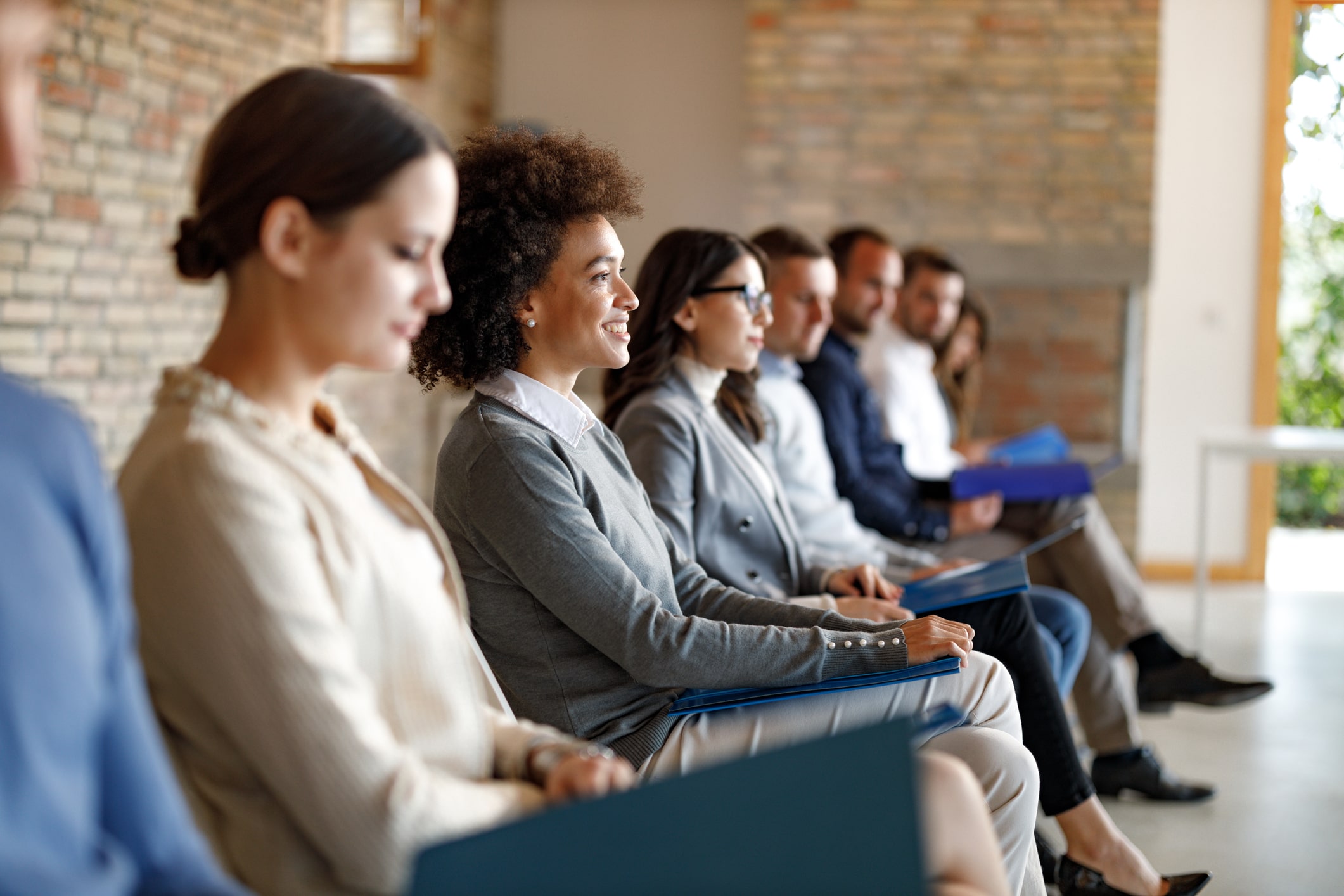 Group-of-people-sitting-waiting-before-job-interview-self-motivation-examples