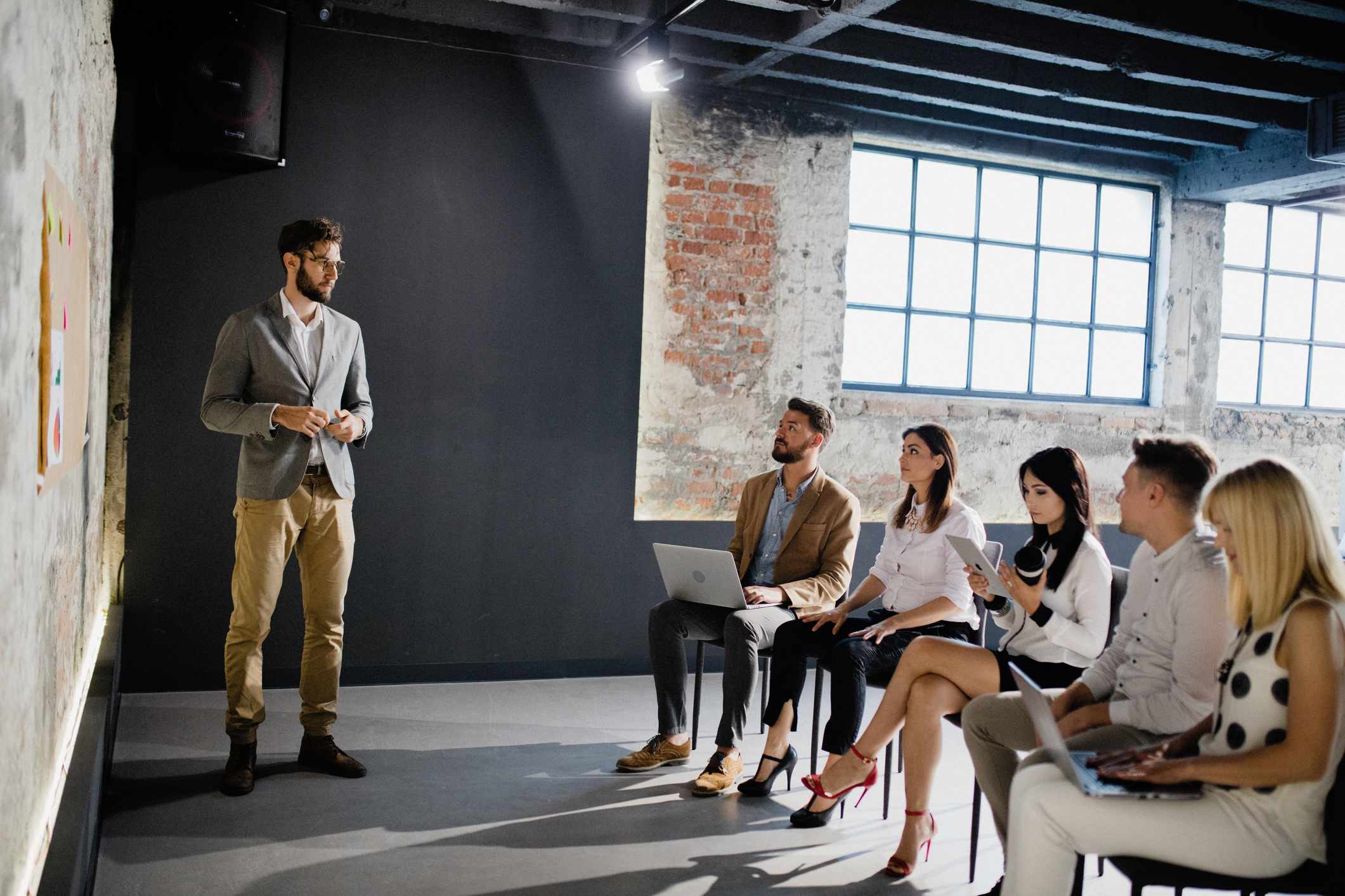 Group-of-people-waiting-for-job-interview-in-room-power-poses