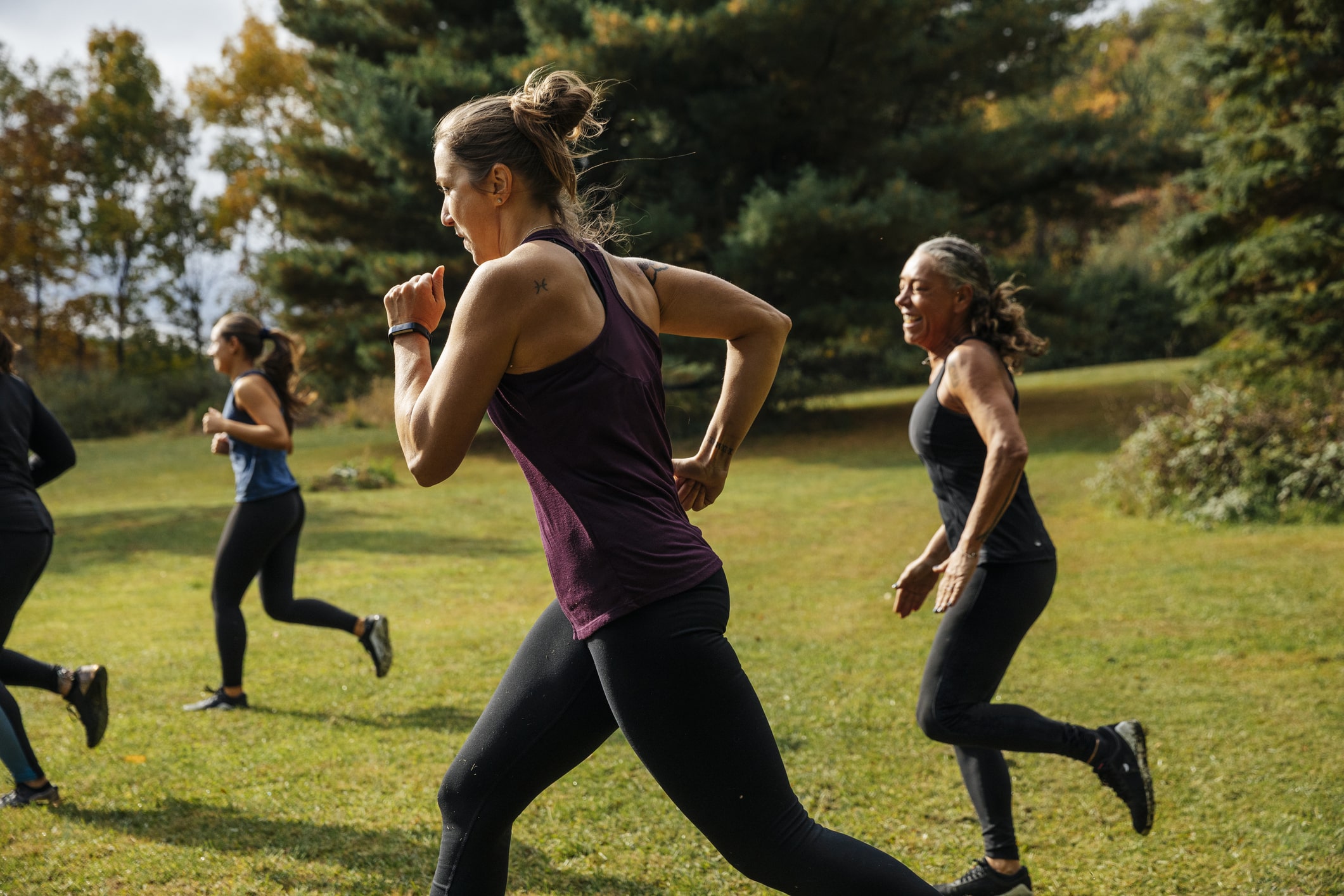 Group-of-women-running-together-at-park-exercise-and-mental-health