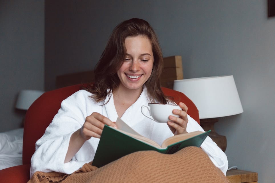 Happy-woman-at-home-reading