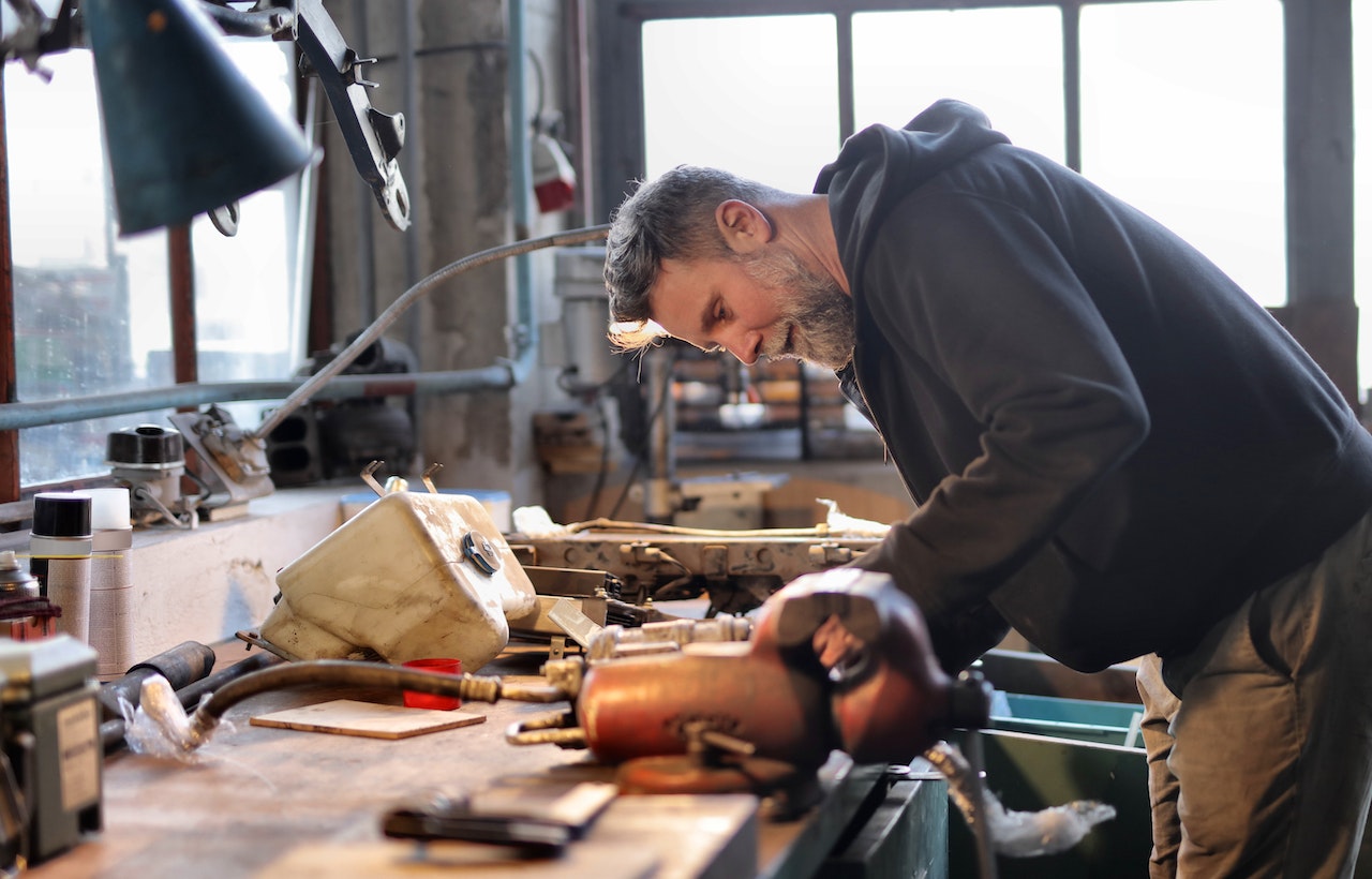 Man-working-on-a-project-with-tools-in-his-shed-interview-coaching