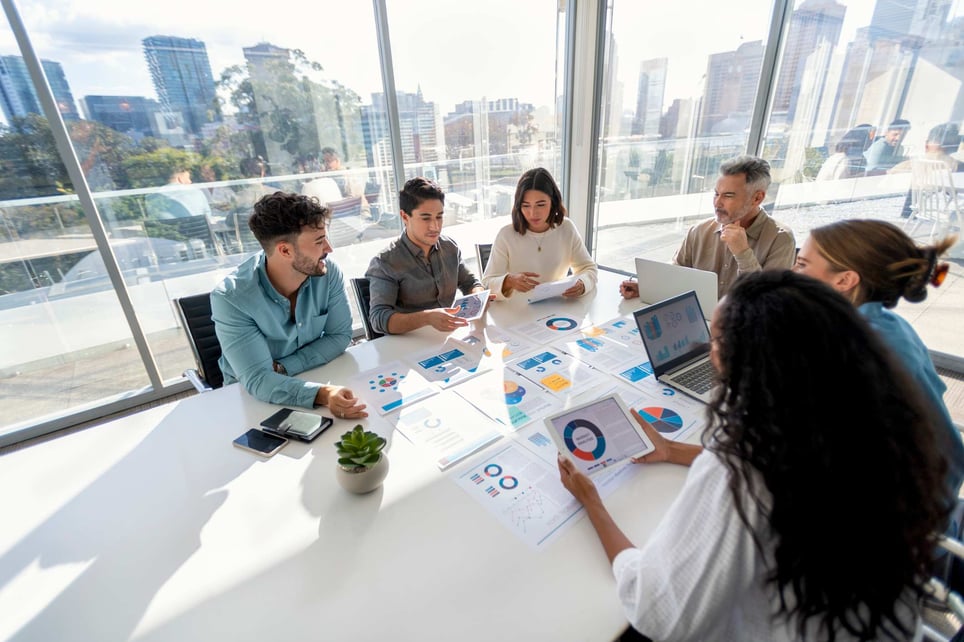Marketing-team-looking-at-printed-analytics-at-meeting-marketing-degree-jobs