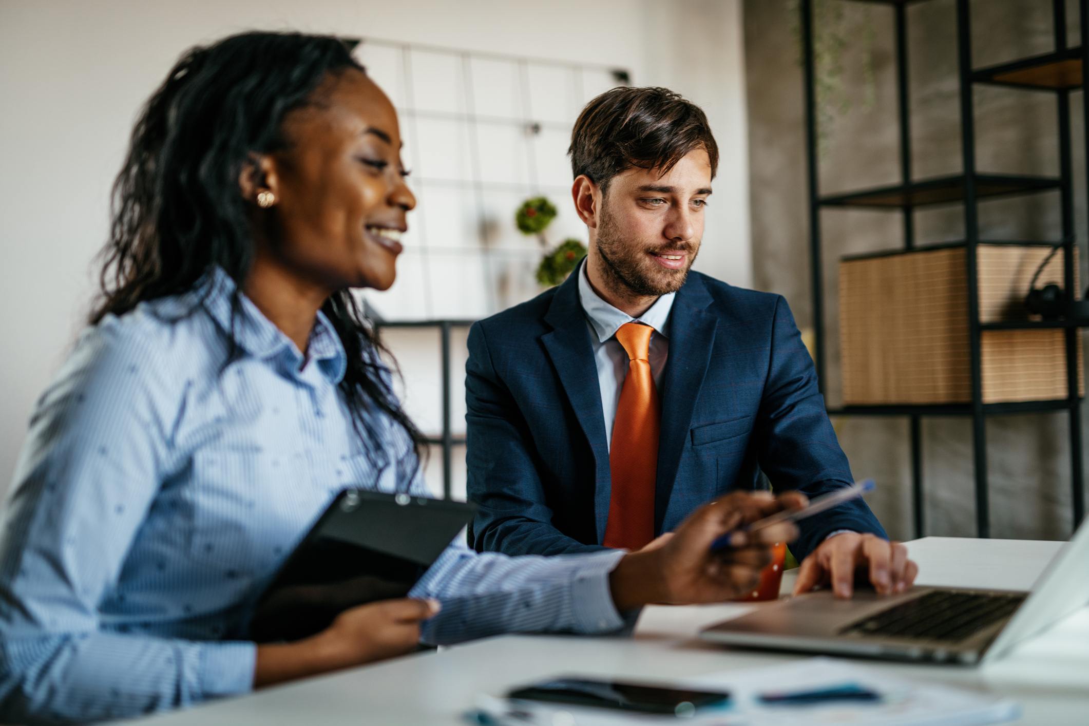 Multi-ethnic-business-people-working-together-in-office-kudos-example