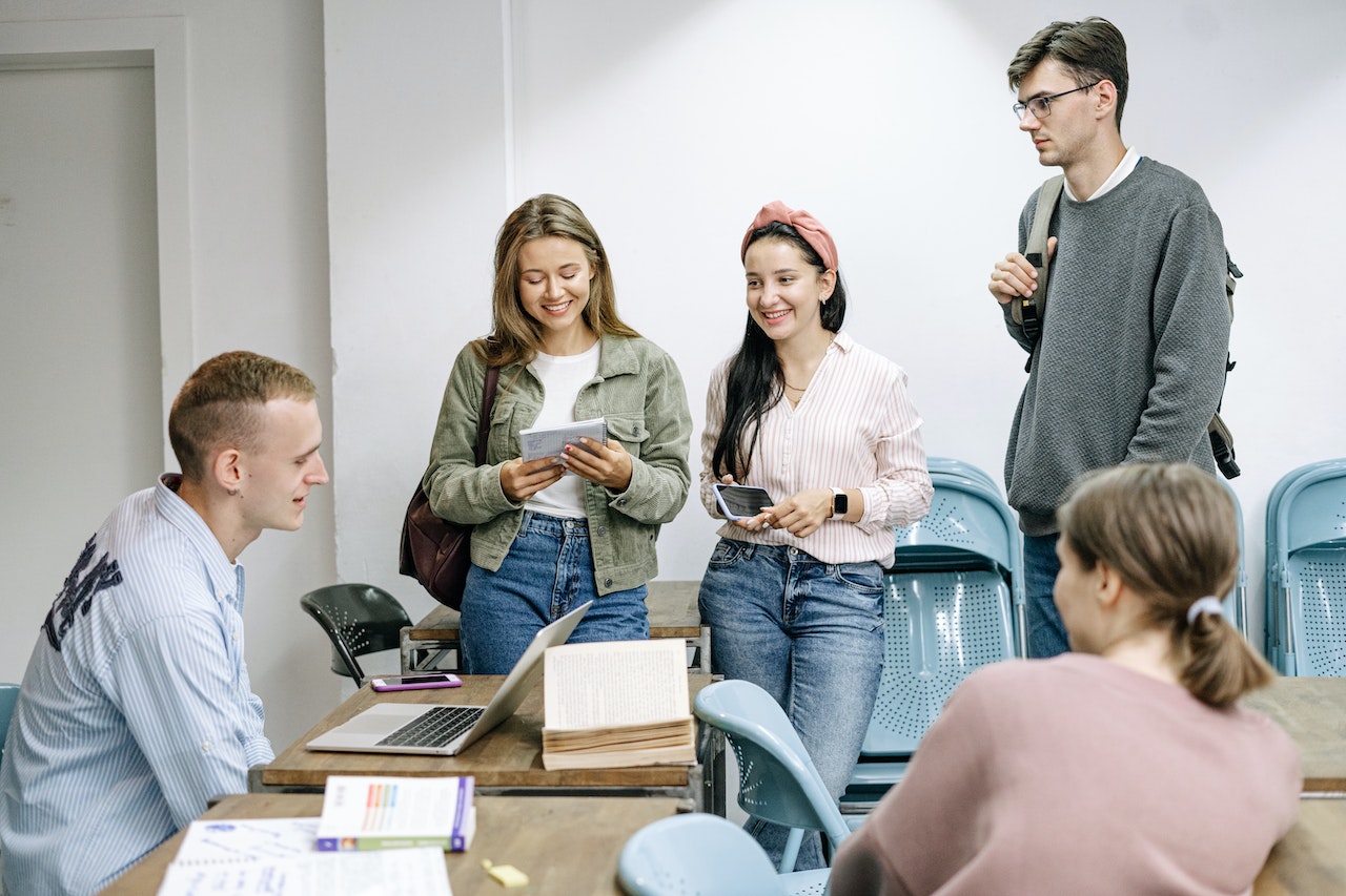 Peers-at-college-classroom-talking-with-laptop-why-take-a-gap-year