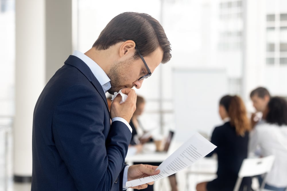 Side-view-insecure-male-holding-paper-reading-preparing-for-performance-why-do-we-fear-failure
