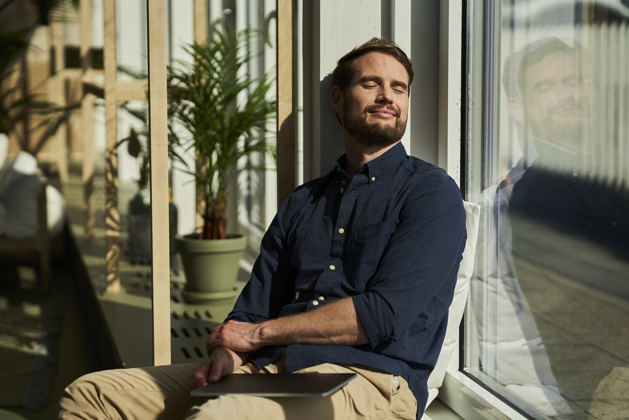 Smiling-male-professional-with-eyes-closed-how-to-be-more-patient