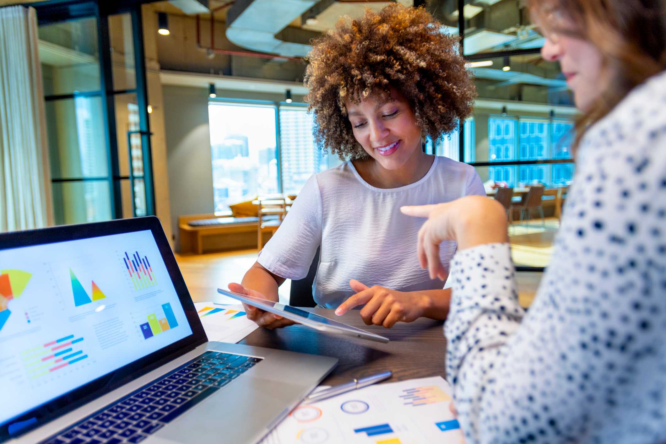 Two-collegues-looking-at-charts-together-marketing-degree-jobs
