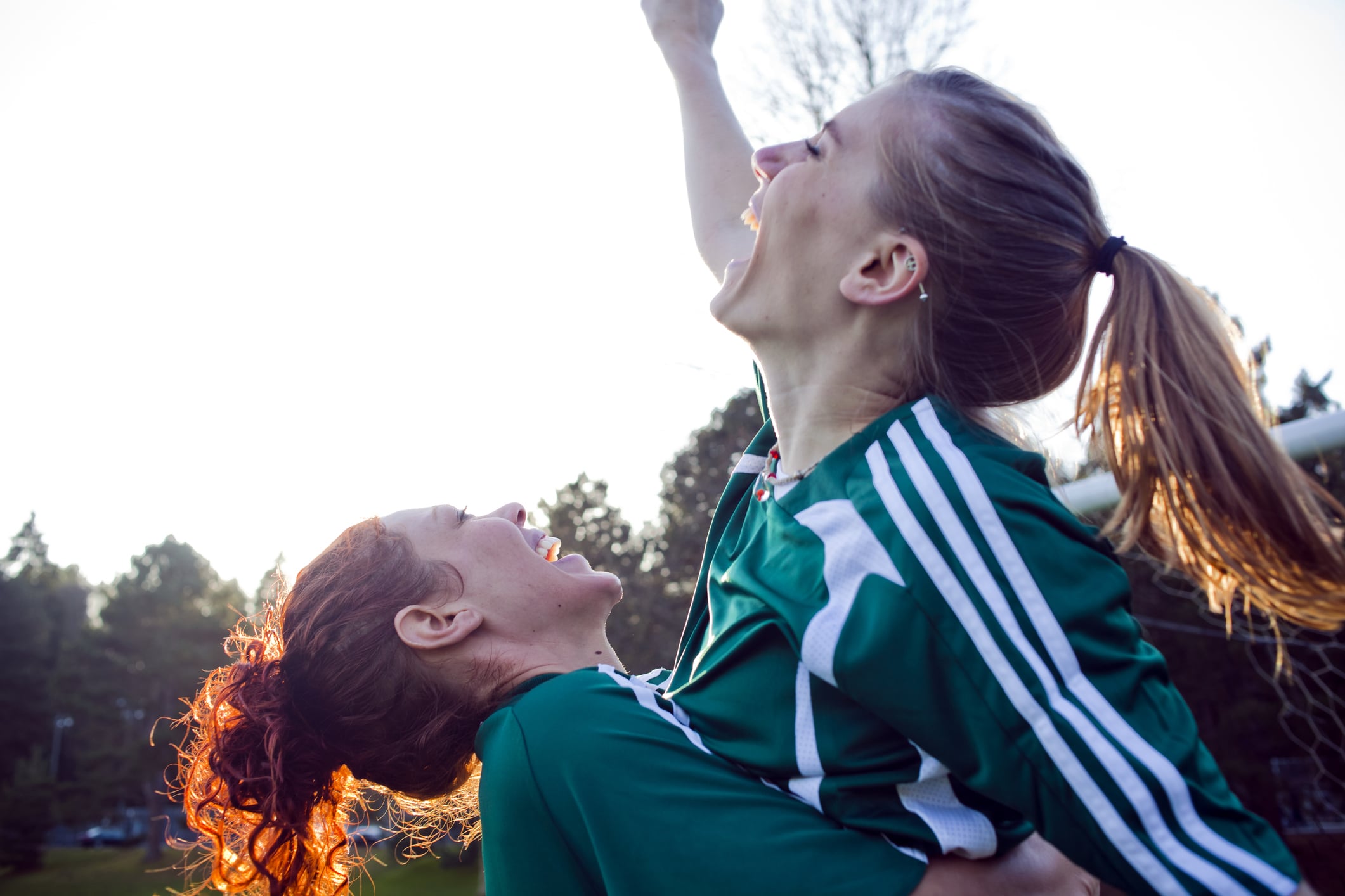 Two-female-friends-cheering-how-to-set-daily-goals