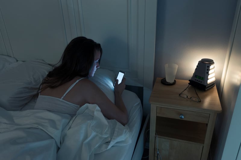 Woman-Checking-Messages-At-Night-1