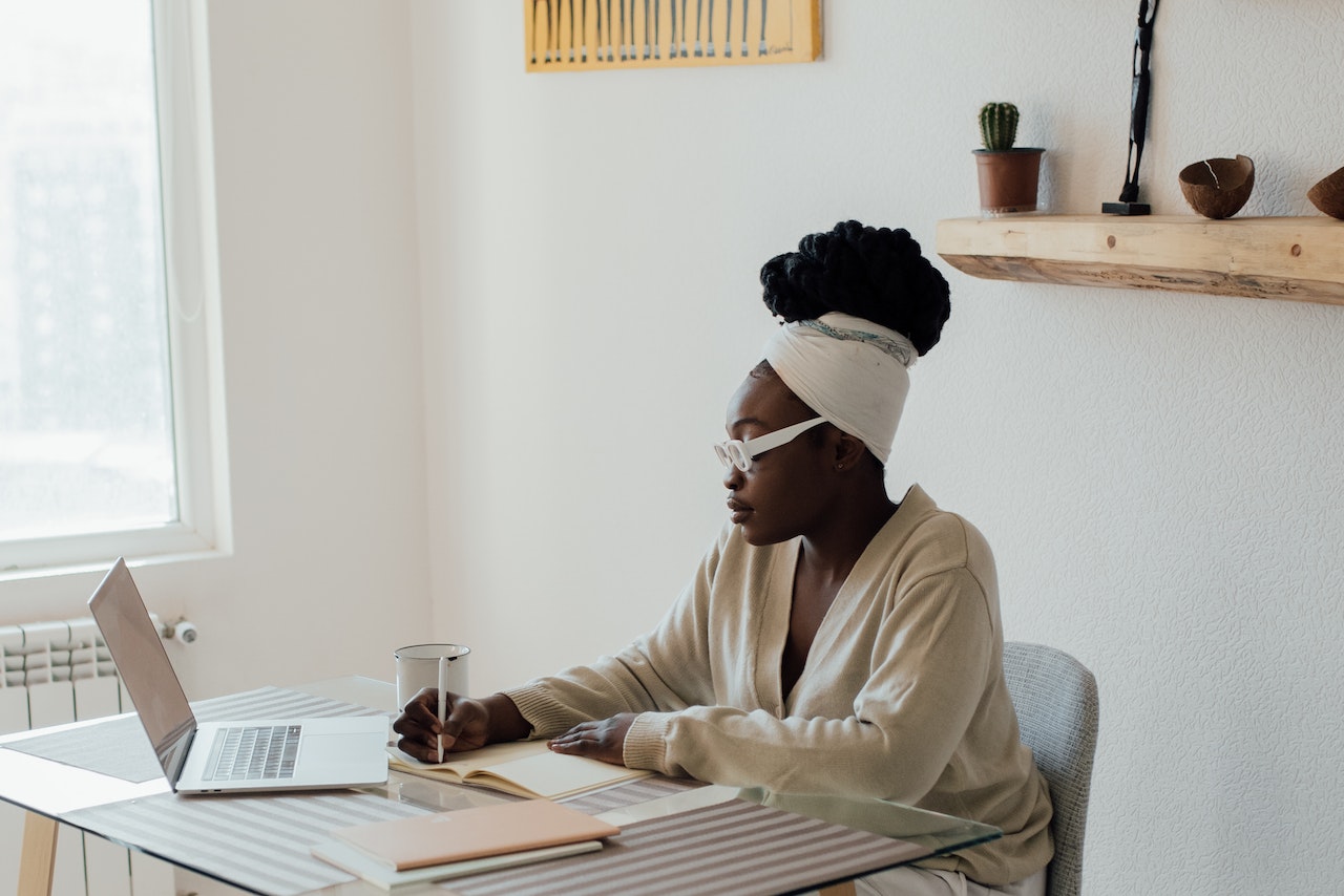 Woman-at-home-journaling-things-to-manifest-ideas