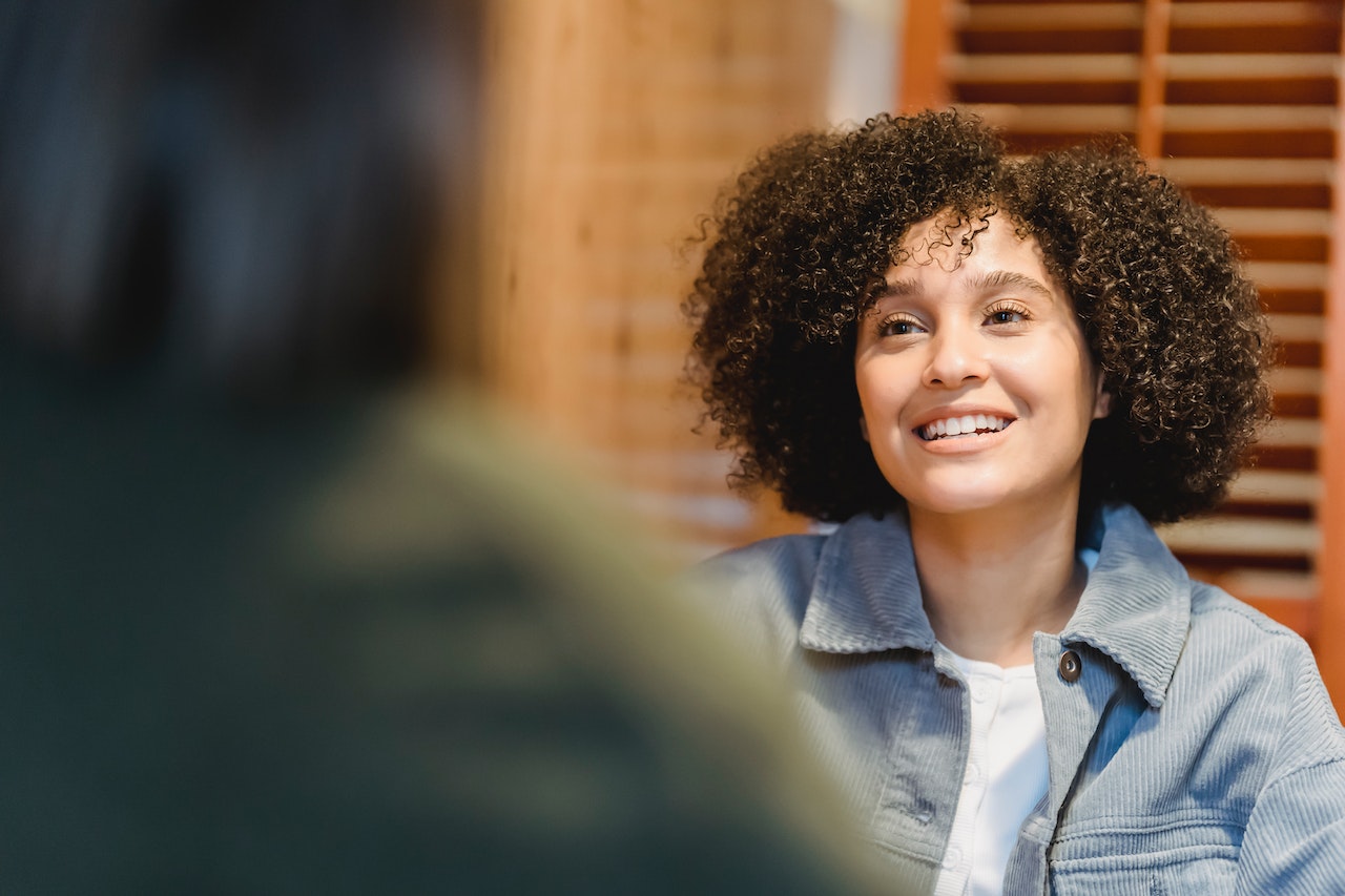 Woman-talking-inspired-looking-up-elevator-pitch-about-yourself