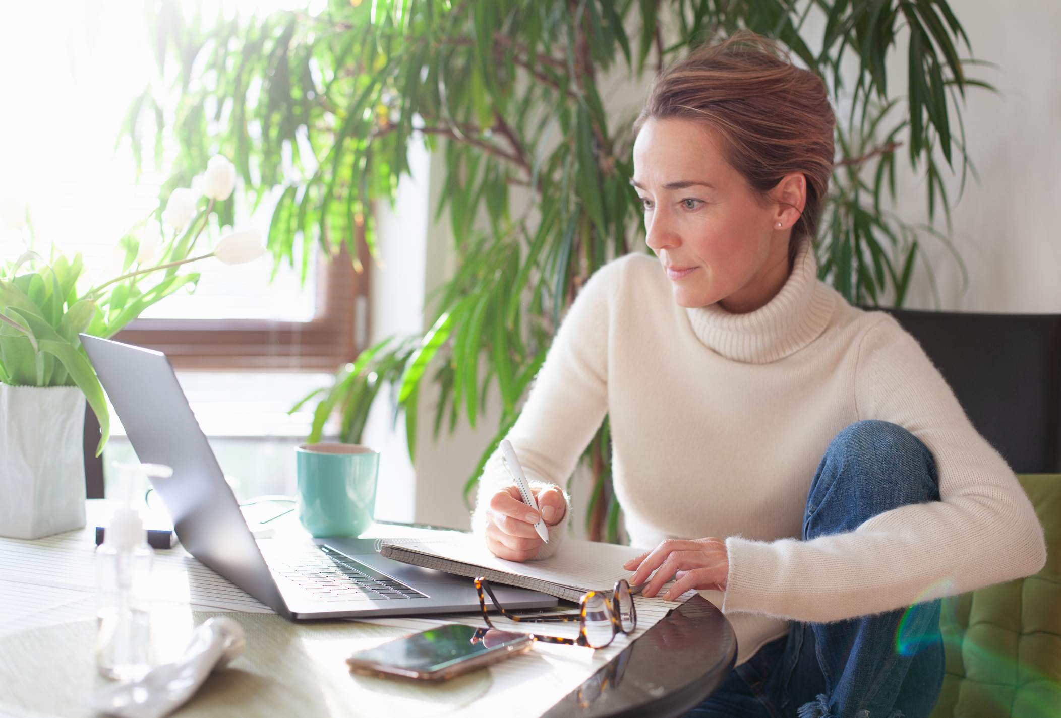 Woman-working-from-home-using-laptop-computer-reentering-the-workforce