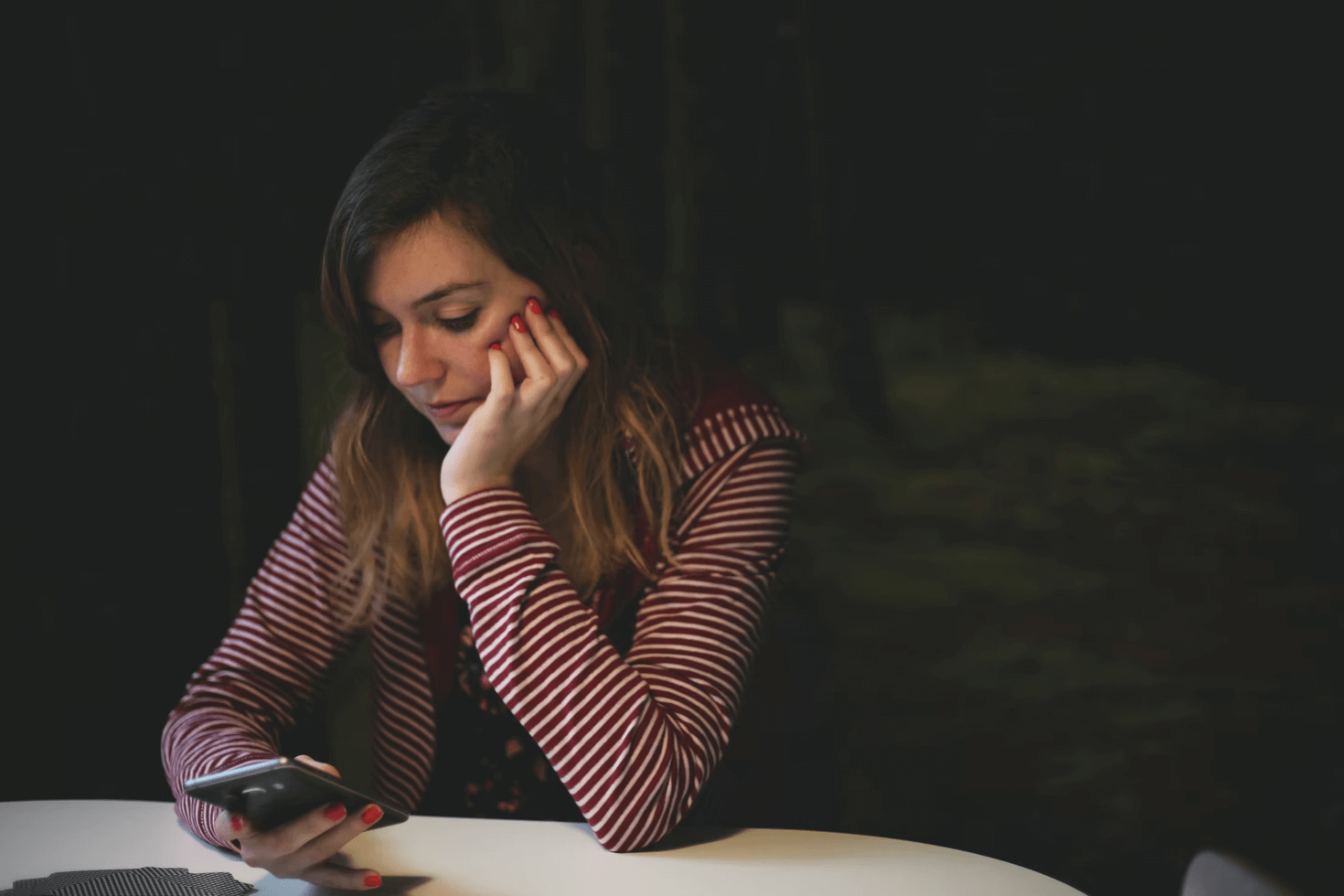 anxious-woman-checking-phone-chronic-stress