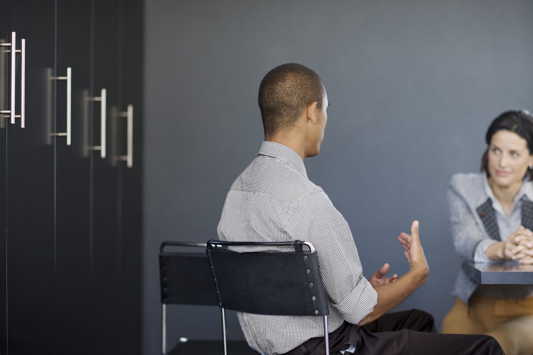 businessman-talking-to-coworker-tell-me-about-a-time-interview-questions