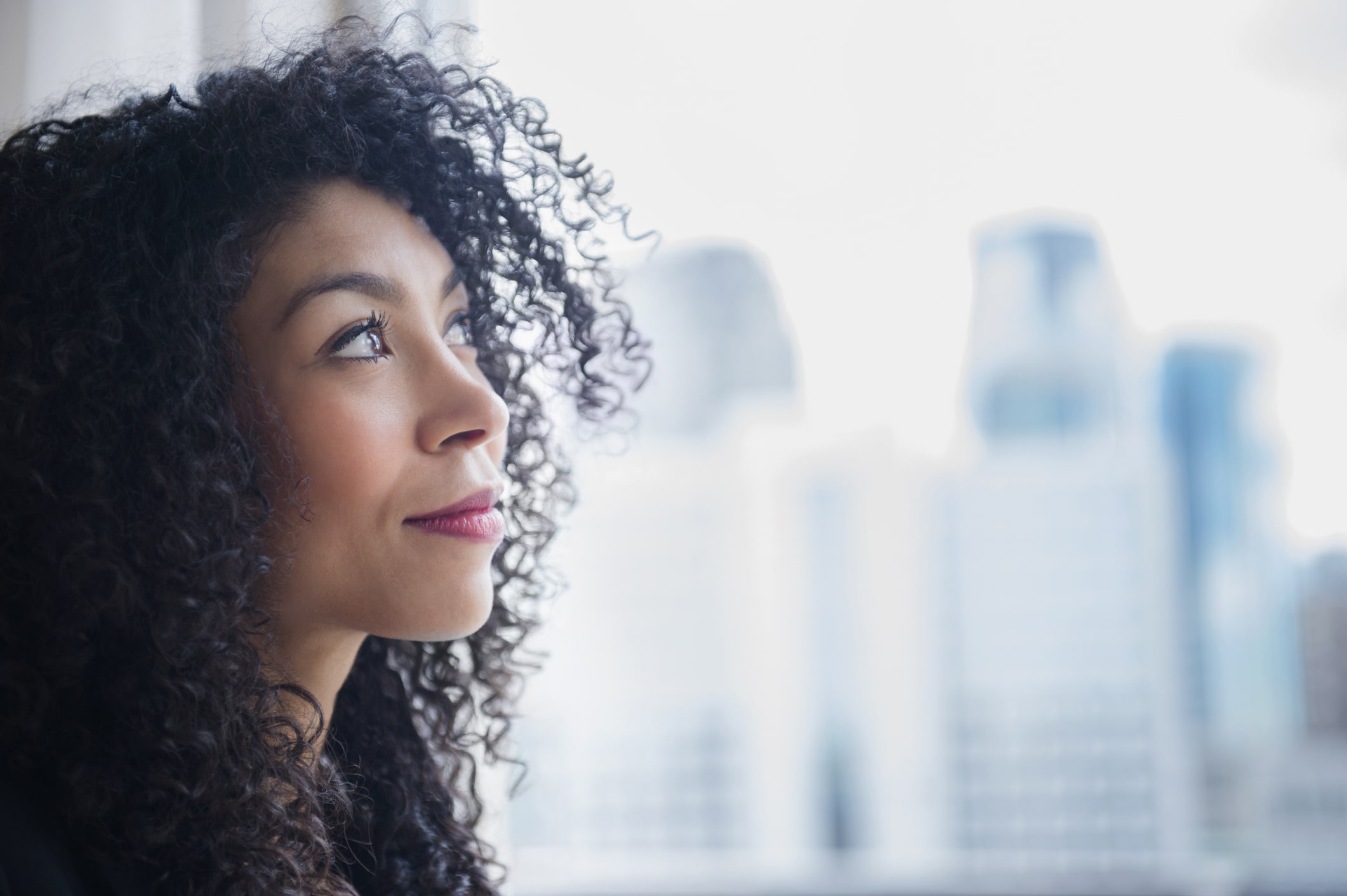 businesswoman-looking-out-window-what-is-a-short-term-goal