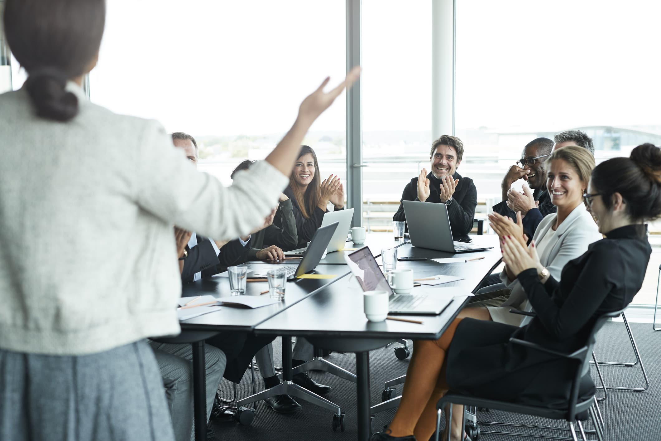 colleagues-celebrating-team-member-yearly-goals-examples