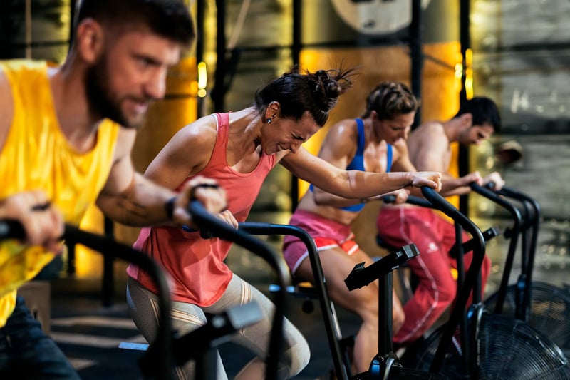 four-people-doing-exercise-in-air-bike-how-to-get-motivated
