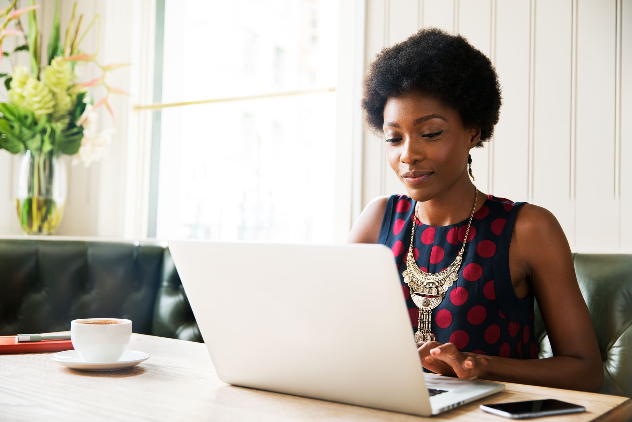 happy-woman-using-her-laptop-to-work-offer-acceptance-email