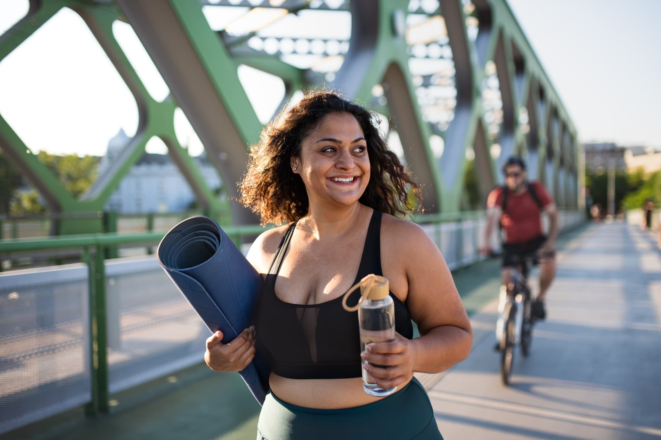 happy-young-woman-walking-how-motivation-helps-in-achieving-goals