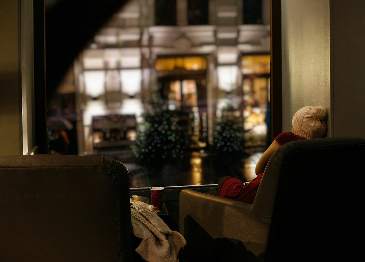 holiday-stress-person-looking-out-of-cafe-window