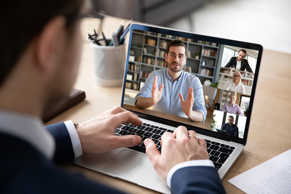 man-explaining-something-while-on-video-interview-job-hopping-syndrome