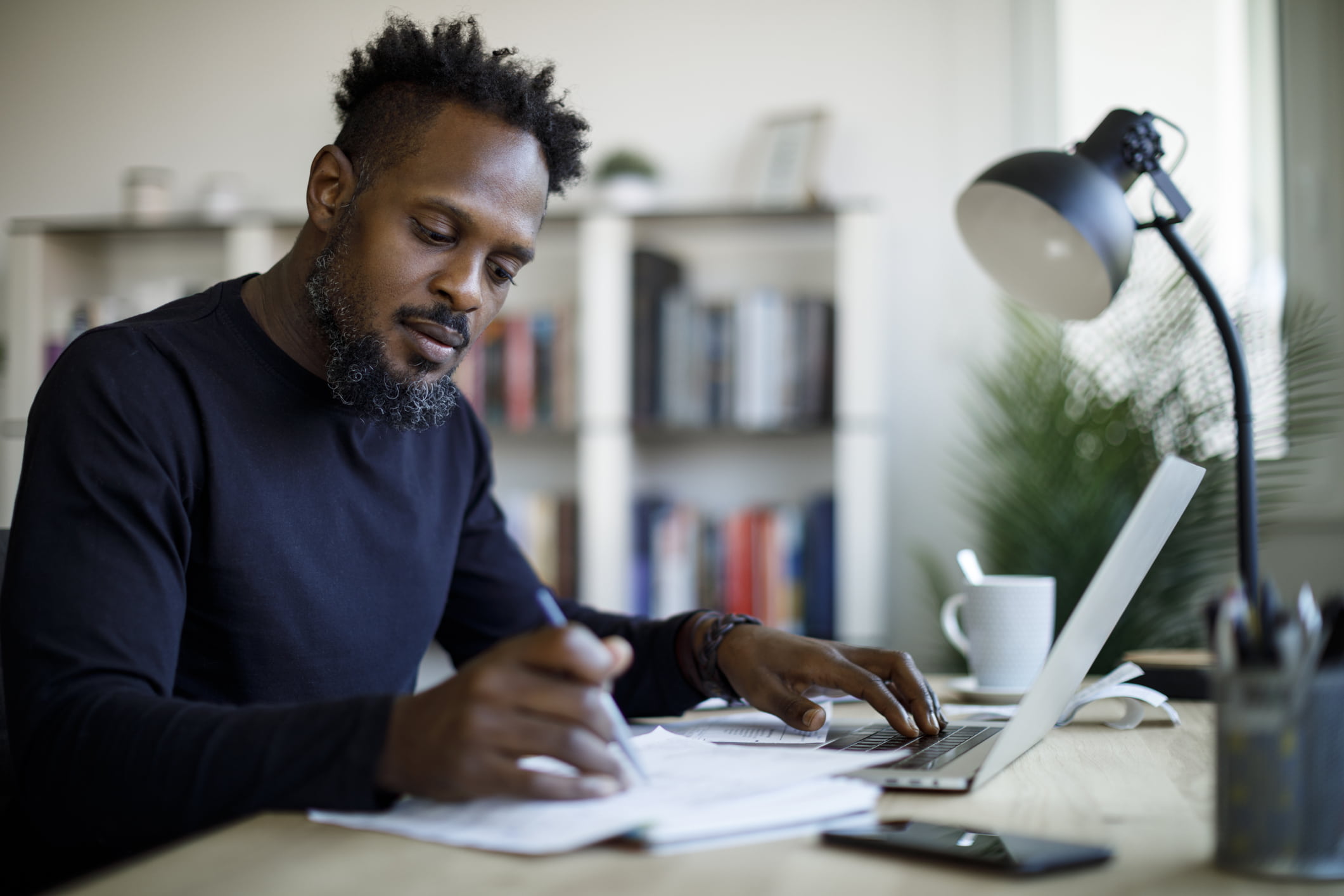 man-journaling-in-his-desk-what-is-mindfulness