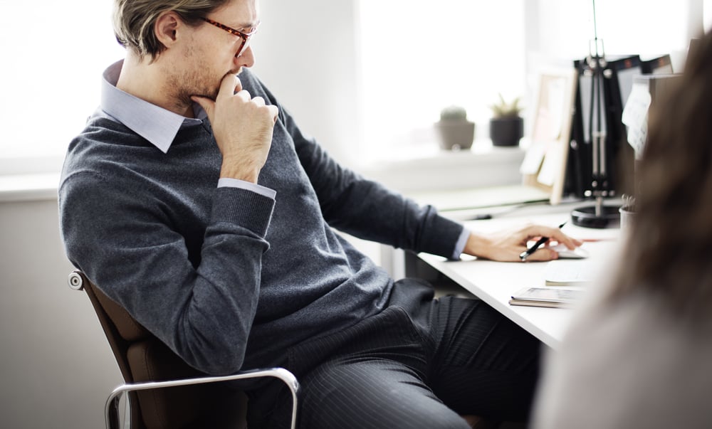 man-thinking-while-sitted-how-to-control-anger-at-work
