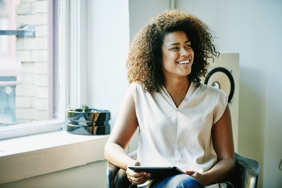 mixed-race-business-woman-smiling——how-to-be-more-persuasive