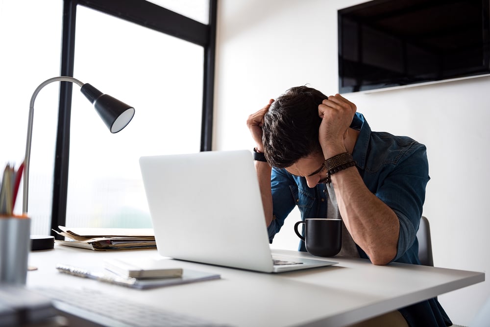 sad-man-working-at-office-what-to-do-when-you-mess-up-at-work