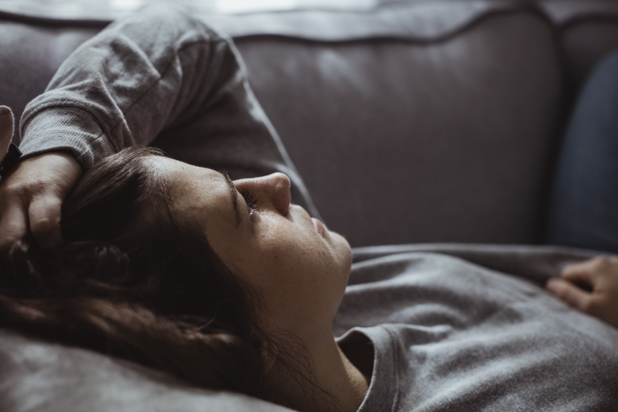 sad-woman-lying-on-sofa-stress-vs-anxiety