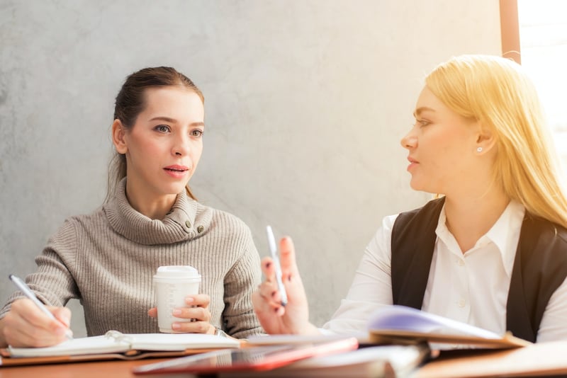 two-women-on-a-negotiation-severance-package-negotiation