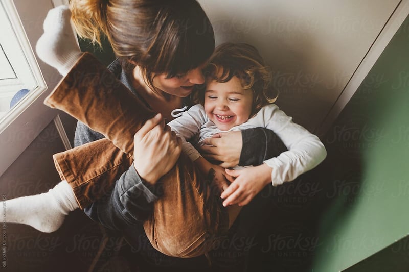 woman-holding-child-automatic-negative-thoughts