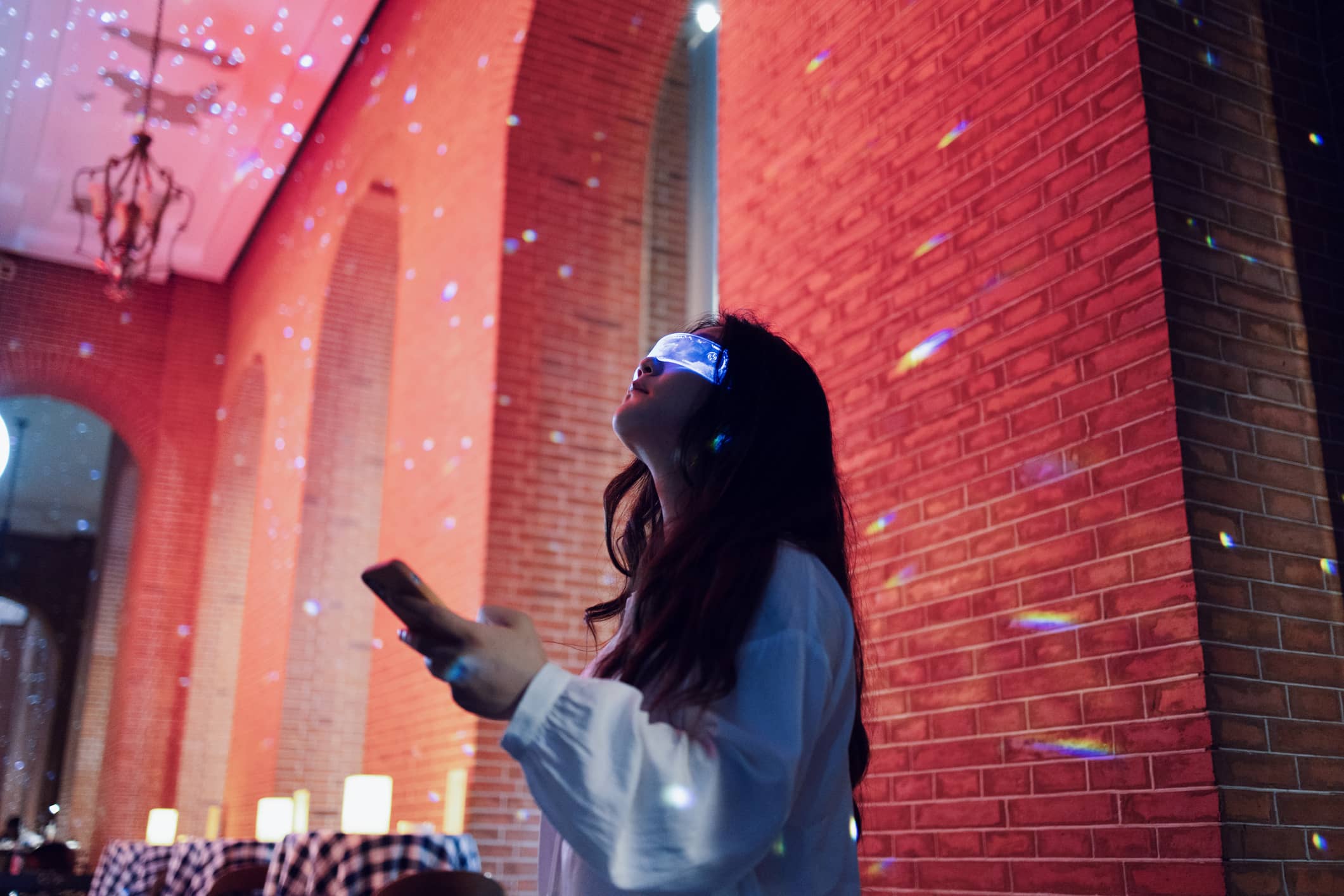 woman-wearing-augmented-reality-glasses-what-is-a-long-term-goal