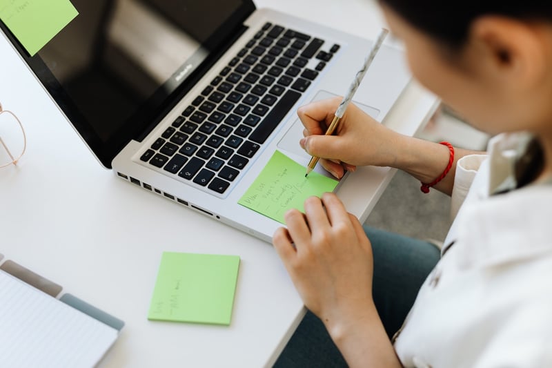woman-writing-a-to-do-list-priority-matrix