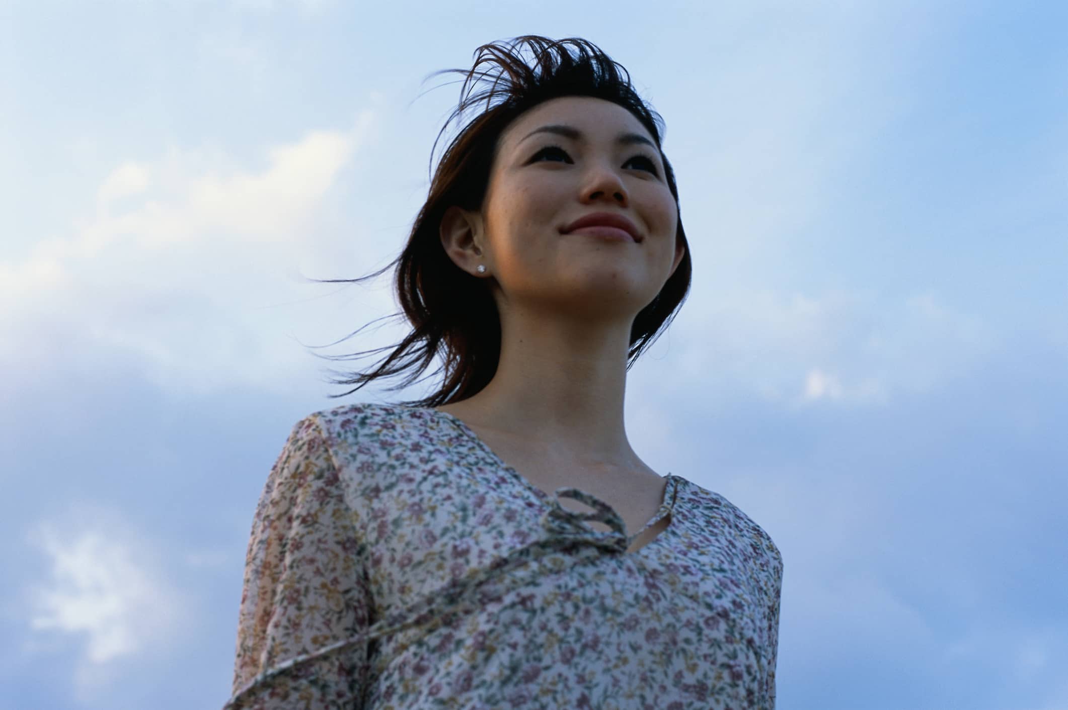 young-woman-smiling-looking-away-negative-reinforcement